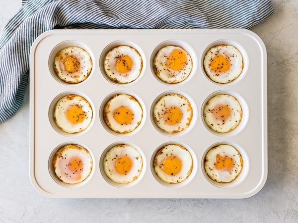 A muffin tin full of baked Pete & Gerry's eggs.