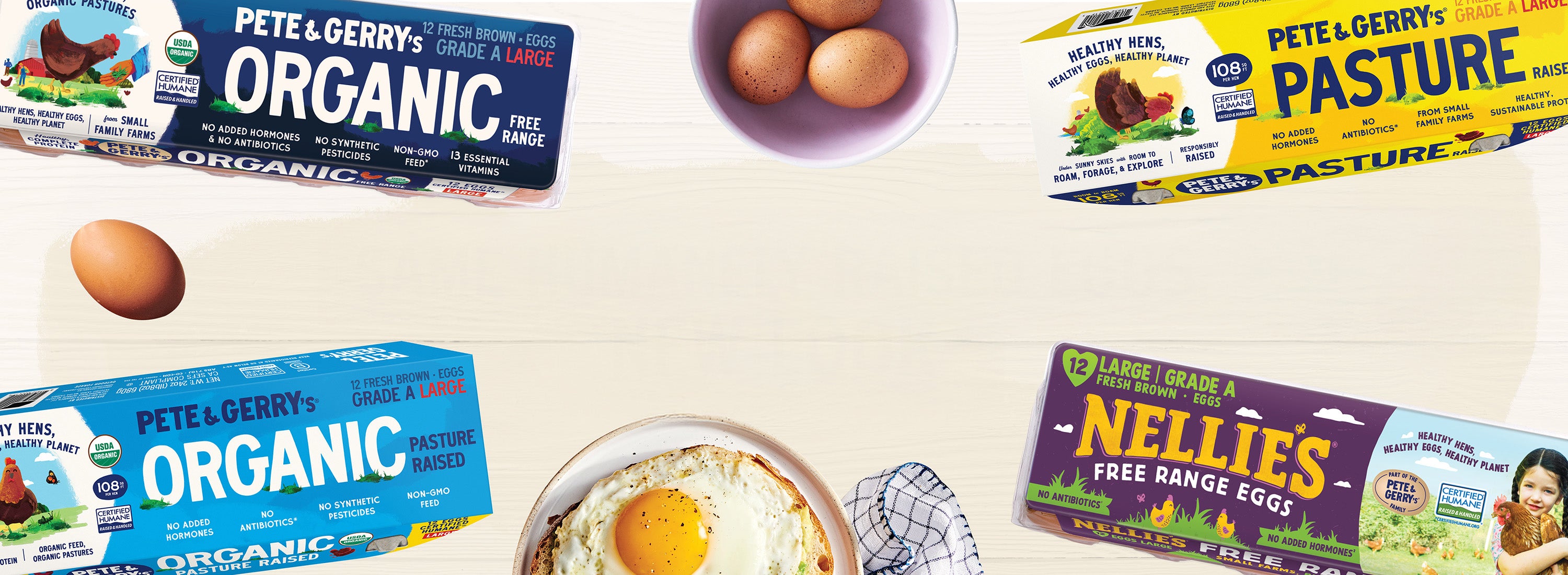 Assorted eggs and egg products including Pete & Gerry's Organic and Nellie's on a white surface.