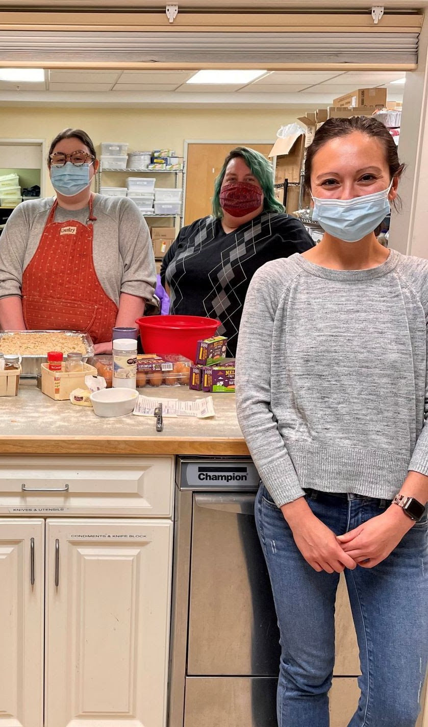 Three people in masks baking with Pete & Gerry's eggs