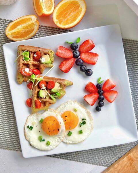 Waffles, dragonflies made of fruit, and two sunny-side-up eggs pete and gerry's organic eggs